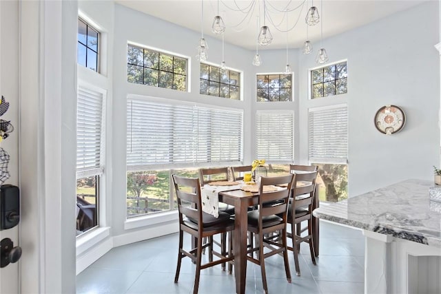 dining space featuring light tile patterned floors