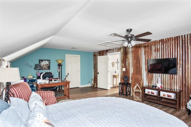 bedroom featuring dark wood-type flooring and vaulted ceiling