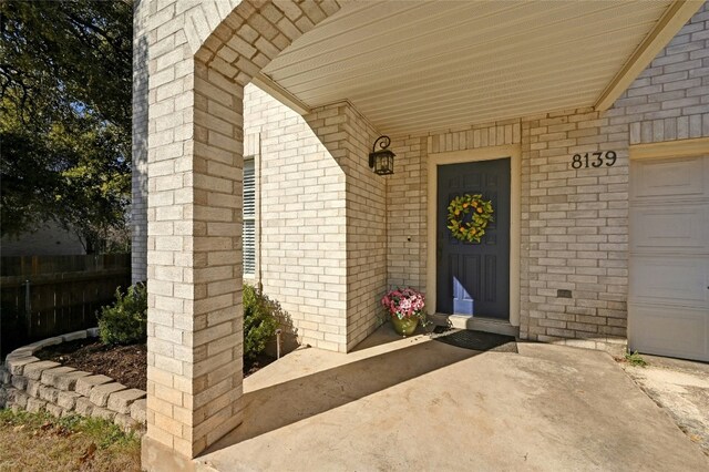 property entrance with a garage