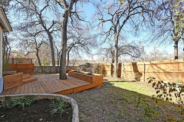 view of yard featuring a fenced backyard and a wooden deck