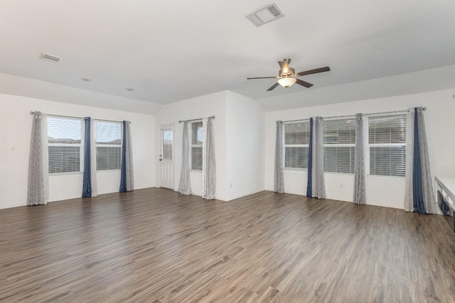 unfurnished room featuring dark hardwood / wood-style floors and ceiling fan