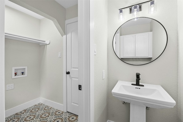 bathroom with tile patterned flooring and sink