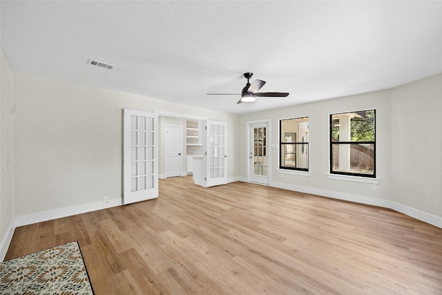 interior space with french doors, ceiling fan, and light hardwood / wood-style flooring