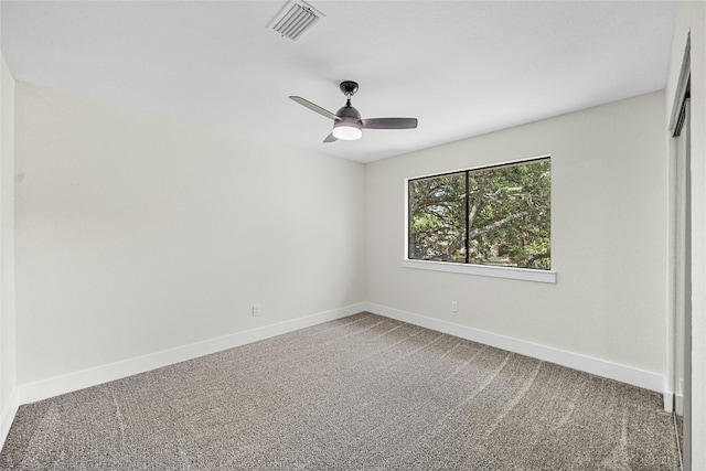 carpeted empty room with ceiling fan