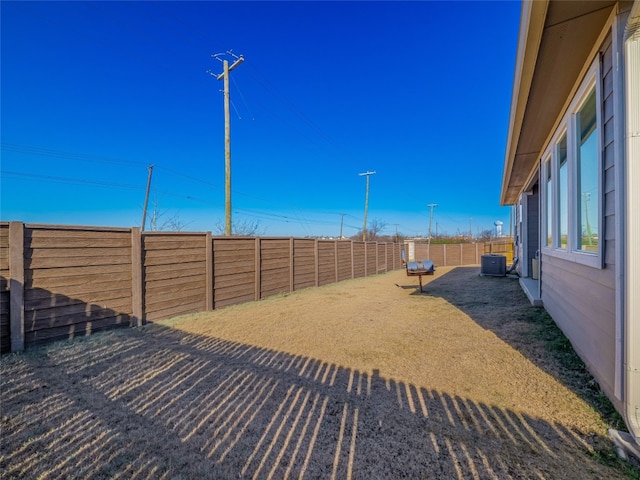 view of yard with central AC