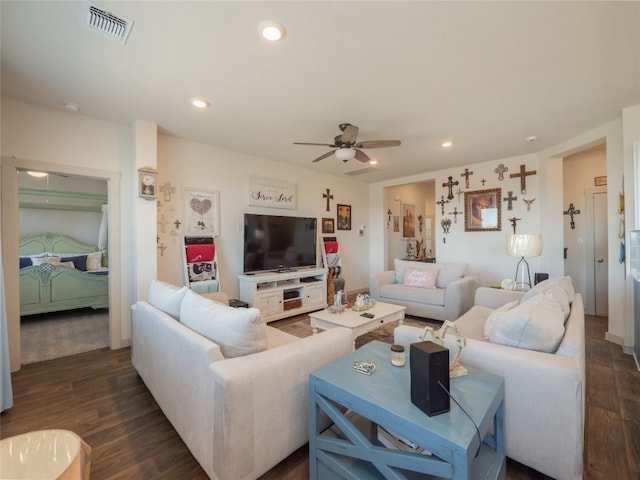 living room with dark hardwood / wood-style floors and ceiling fan