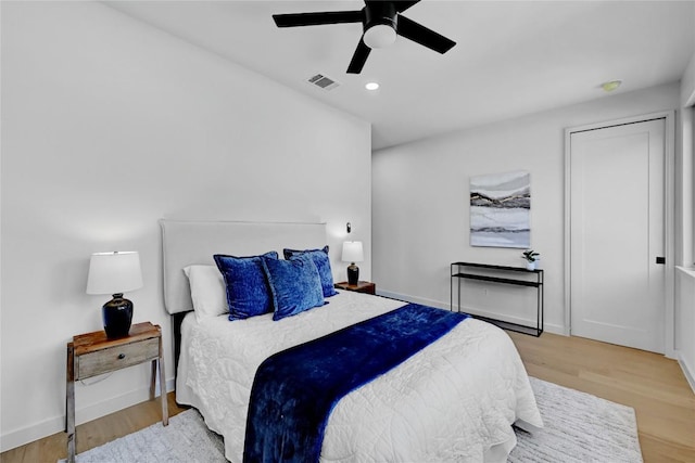 bedroom featuring ceiling fan and light hardwood / wood-style floors