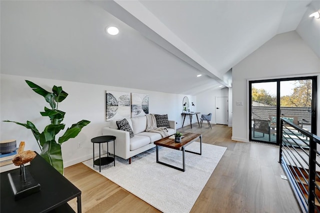 living room with lofted ceiling and hardwood / wood-style flooring