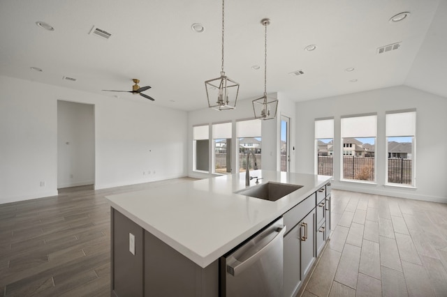 kitchen with sink, a wealth of natural light, dishwasher, and a center island with sink