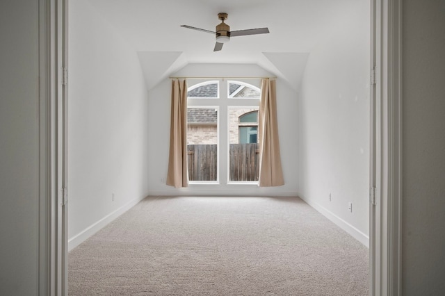 additional living space featuring ceiling fan, lofted ceiling, and carpet floors