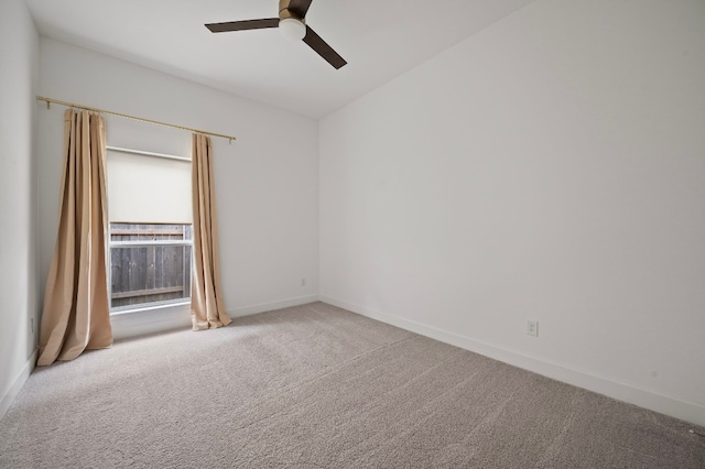 carpeted empty room featuring ceiling fan