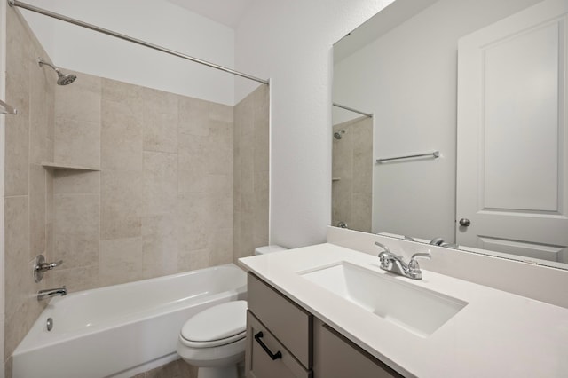 full bathroom with vanity, toilet, and tiled shower / bath