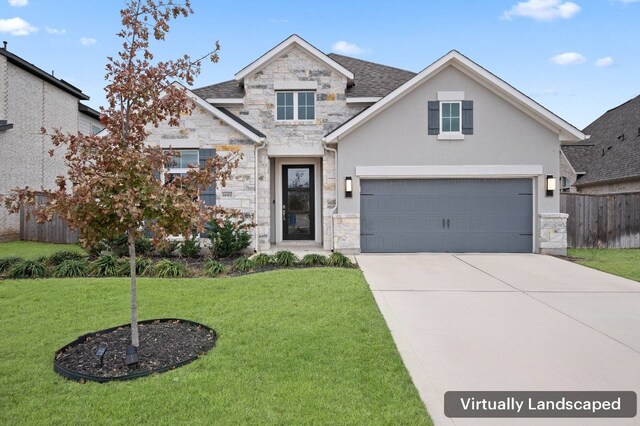 view of front facade featuring a garage and a front lawn