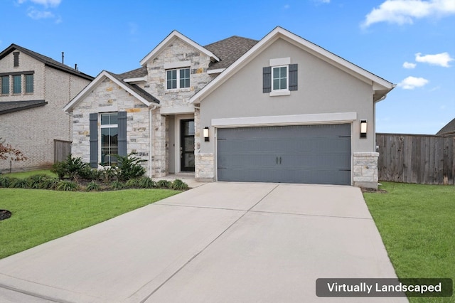 view of front of home featuring a garage and a front yard