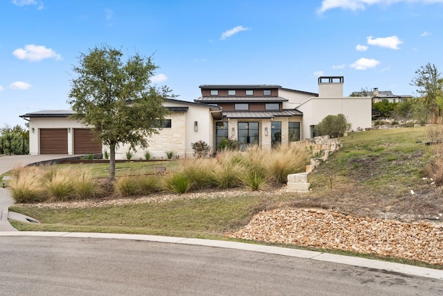 view of front of home with a garage