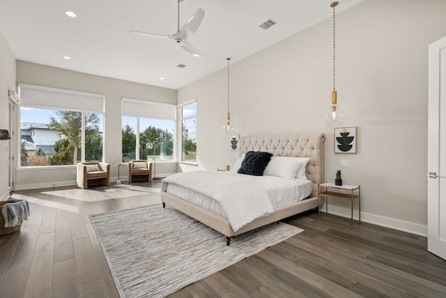 bedroom with ceiling fan and hardwood / wood-style floors