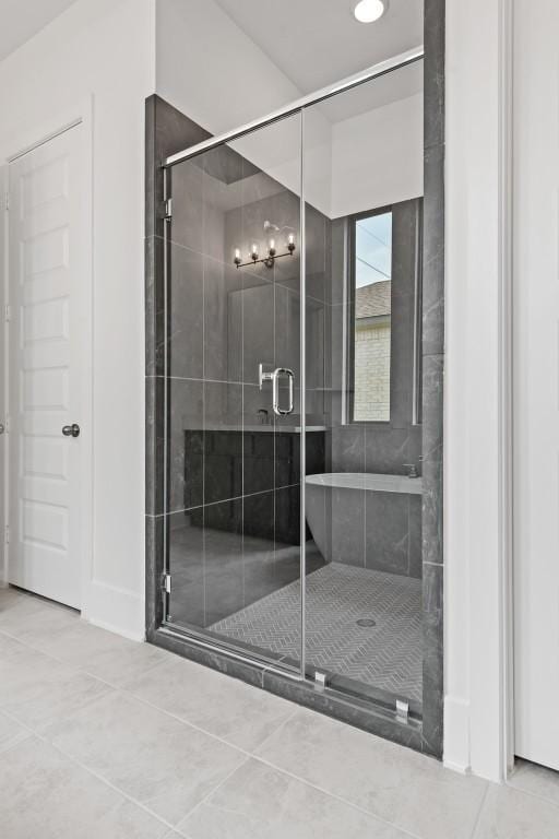 bathroom featuring walk in shower and tile patterned floors