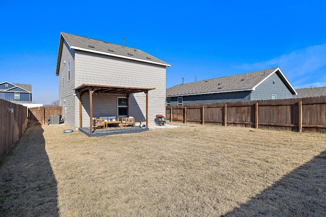 13413 Mussel Run, Elgin, TX 78621 - back of property with a fenced backyard, a patio area, and an outdoor living space