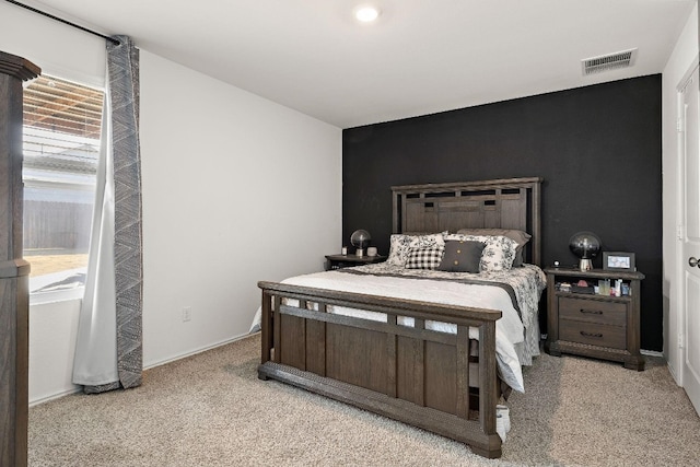 13413 Mussel Run, Elgin, TX 78621 - bedroom with light colored carpet and an accent wall