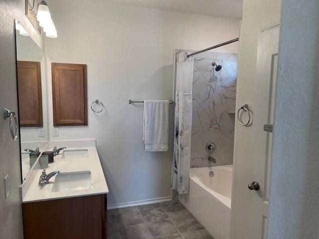 bathroom featuring vanity and shower / bathtub combination with curtain