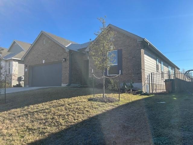 view of front of home with a garage and a front yard