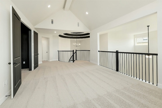 spare room featuring recessed lighting, light carpet, a notable chandelier, visible vents, and beamed ceiling