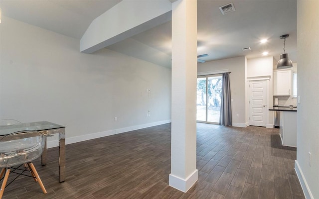 1905 Standing Tall Dr Unit 40, Leander, TX 78641 - unfurnished living room featuring dark wood-type flooring, baseboards, and ceiling fan