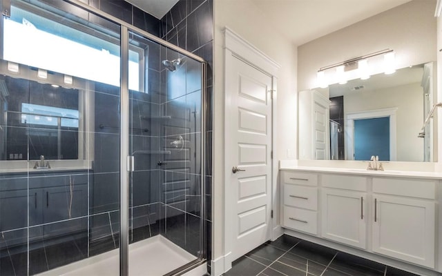 1905 Standing Tall Dr Unit 40, Leander, TX 78641 - bathroom with a shower stall, tile patterned floors, and vanity