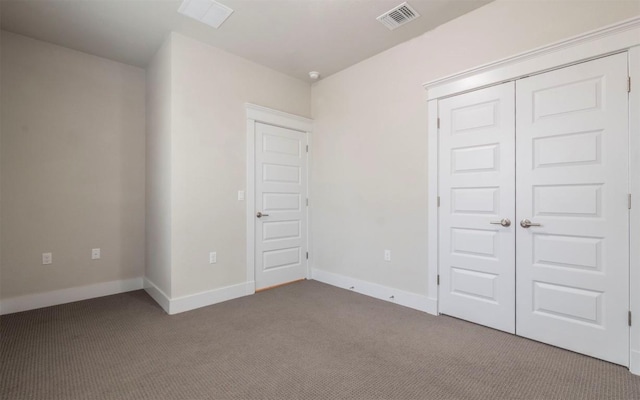 1905 Standing Tall Dr Unit 40, Leander, TX 78641 - unfurnished bedroom featuring carpet, a closet, and baseboards