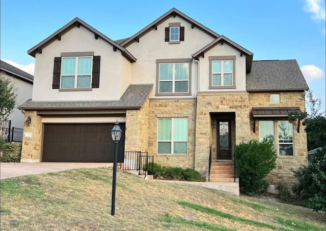 view of front of home featuring a garage and a front lawn