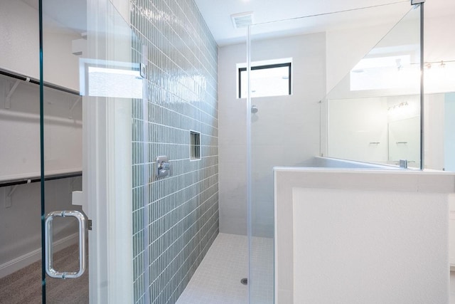 228 Running Fawn, Georgetown, TX 78628 - full bathroom featuring a stall shower and a spacious closet