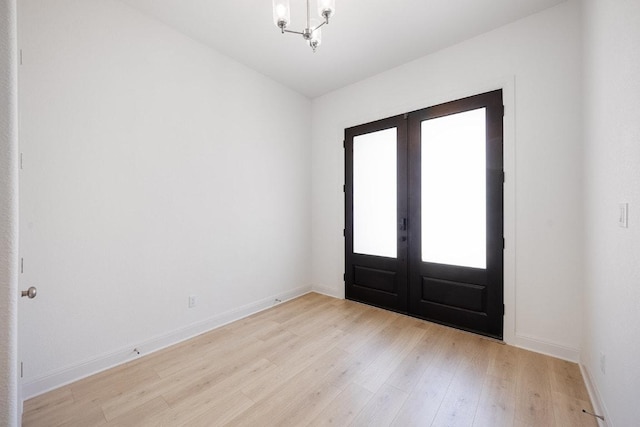 228 Running Fawn, Georgetown, TX 78628 - entryway featuring french doors, light wood-type flooring, and a chandelier