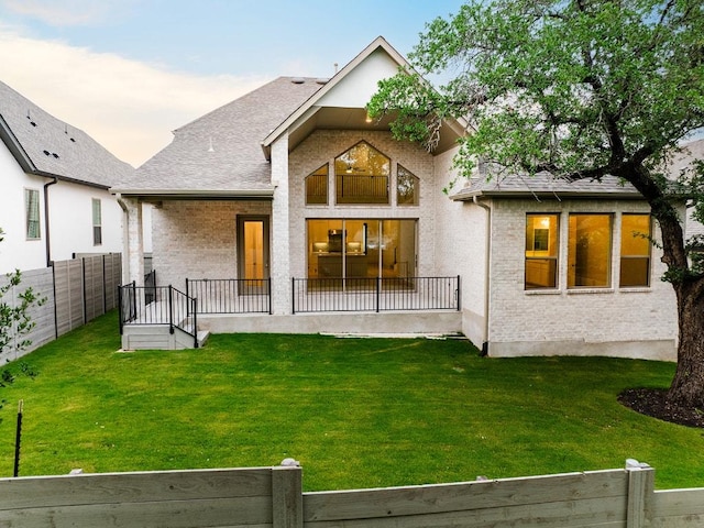 228 Running Fawn, Georgetown, TX 78628 - back of property with brick siding and a shingled roof