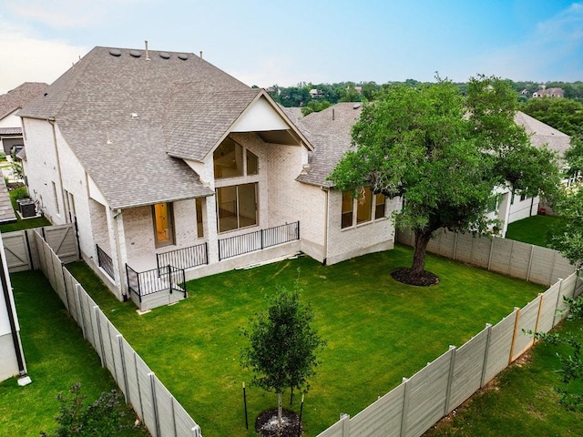 228 Running Fawn, Georgetown, TX 78628 - rear view of property with roof with shingles, a fenced backyard, and stucco siding