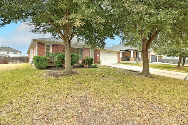 ranch-style home with a garage and a front lawn