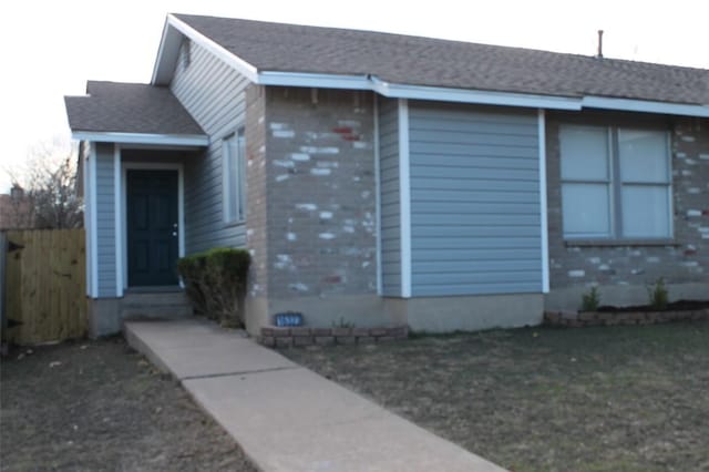 view of side of property featuring a yard