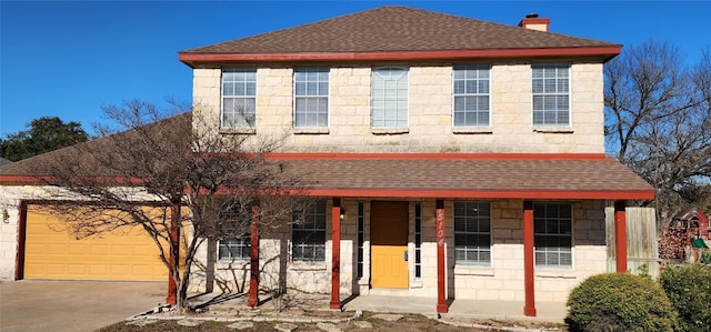 view of front of property featuring a garage