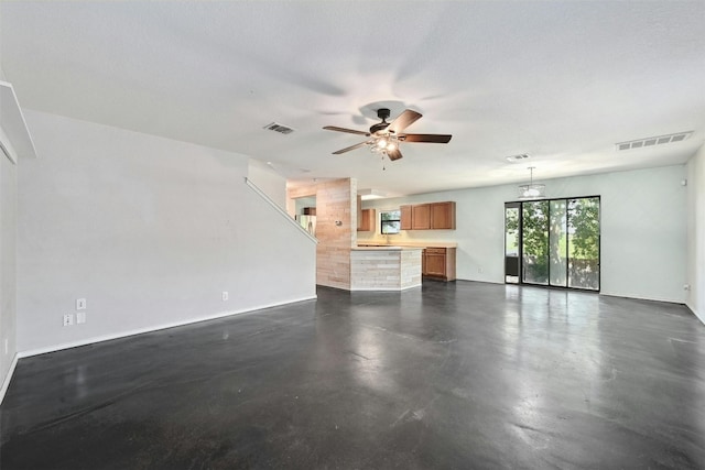 unfurnished living room with ceiling fan