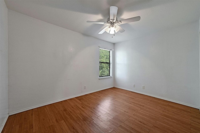 unfurnished room featuring hardwood / wood-style flooring and ceiling fan