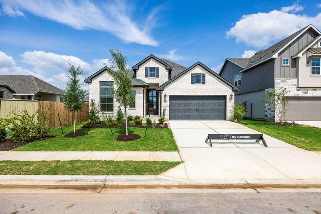 228 La Venta Loop, Liberty Hill, TX 78642 - view of front of property featuring driveway and stone siding