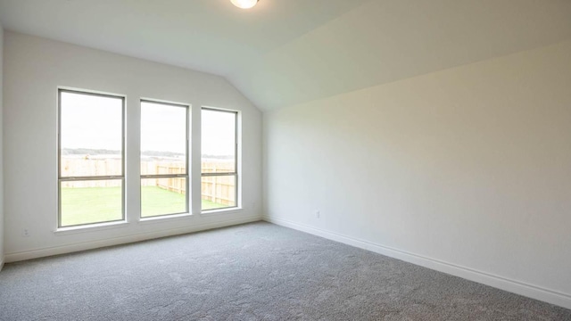 228 La Venta Loop, Liberty Hill, TX 78642 - carpeted empty room featuring vaulted ceiling and baseboards