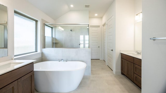 228 La Venta Loop, Liberty Hill, TX 78642 - full bathroom featuring a stall shower, a soaking tub, two vanities, tile patterned floors, and recessed lighting