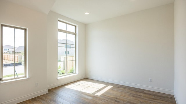 228 La Venta Loop, Liberty Hill, TX 78642 - spare room with wood finished floors, baseboards, and recessed lighting