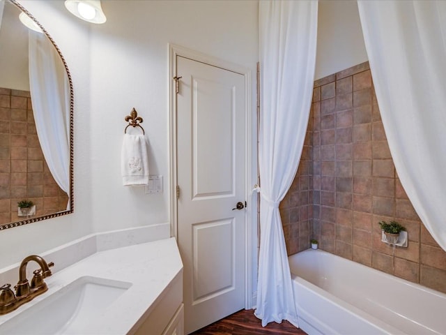 bathroom featuring shower / bath combination with curtain, vanity, and wood-type flooring