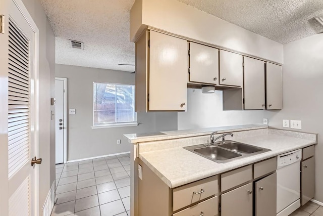 kitchen featuring sink, a textured ceiling, dishwasher, and light tile patterned flooring