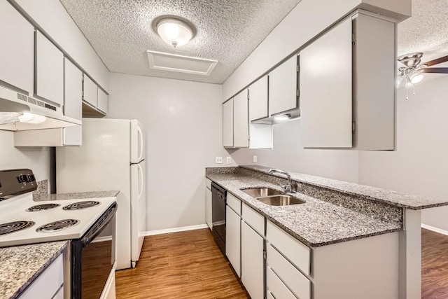 kitchen with electric stove, sink, dishwasher, white cabinetry, and a textured ceiling