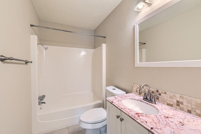 full bathroom with backsplash, vanity, shower / bathing tub combination, a textured ceiling, and toilet