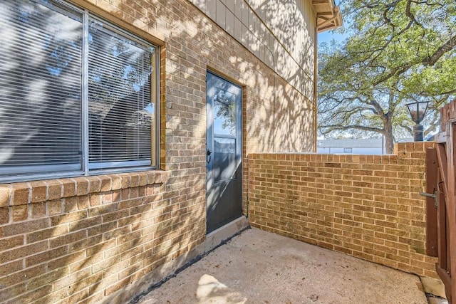 doorway to property featuring a patio