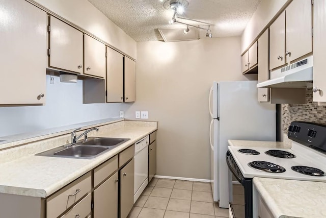 kitchen with white dishwasher, sink, electric range, and a textured ceiling