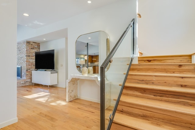 stairway featuring wood-type flooring